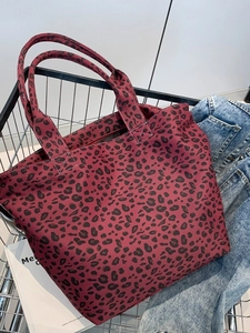 Leopard print canvas tote bag in deep red with reinforced white stitching and large capacity