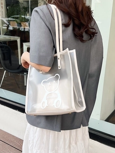 Transparent waterproof PVC tote bag with bear print and leather handles for beach or travel