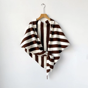 Close-up of the textured stripe knit fabric and front knot detail on the triangle shawl
