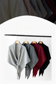 Detailed texture of soft knitted wool blend shawls in multiple Morandi color options