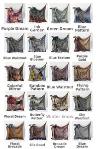 Close-up of silk scarves collection featuring paisley and floral prints in various colors