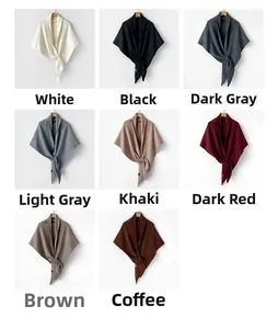 Detail view of 8 colors of high-quality wool knit triangular shawls and winter scarves