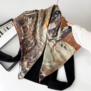 Detail of silk scarf with vintage abstract oil painting texture and rolled edges