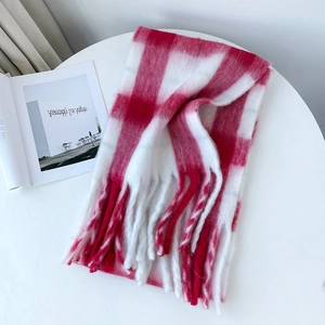 Close-up of thick red and white checkerboard mohair scarf with soft fringe details