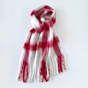 Close-up of red and white plaid mohair scarf texture with soft brushed fuzzy finish
