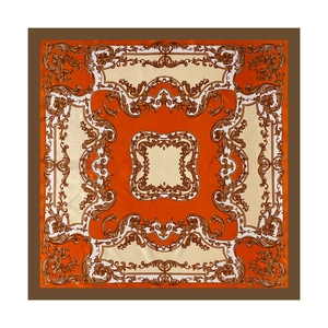 Detail view of square satin scarf with baroque scroll pattern and orange border
