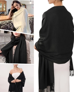 Close-up of soft cashmere-feel fabric and neat fringe details on a long scarf