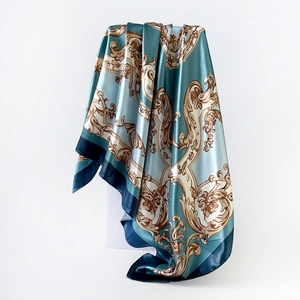 Baroque print satin square headscarf in blue and beige on a minimalist white stand
