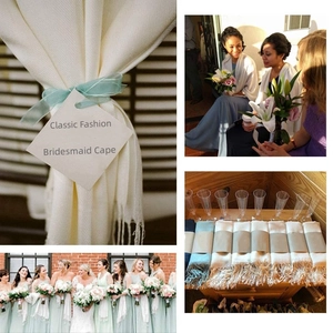 Detail of bridesmaid shawls with tassels and gift tags in soft beige and blue colors