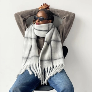 Detailed view of thick windowpane check scarf with grey and white mohair texture