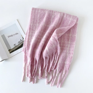 Detail of pink and white wool blend scarf with soft mohair texture and long fringes