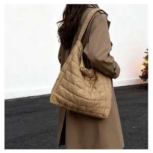 Quilted tote bag in caramel brown featuring a padded puff texture for autumn fashion