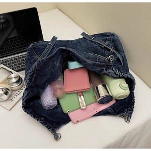 Interior view of large capacity washed denim tote bag showing spacious storage space