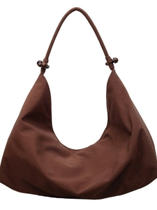 Brown half-moon canvas shoulder bag featuring decorative dark wooden beads on strap
