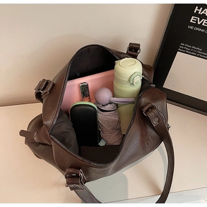 Large vintage brown faux leather tote bag with ample space for daily commuting essentials