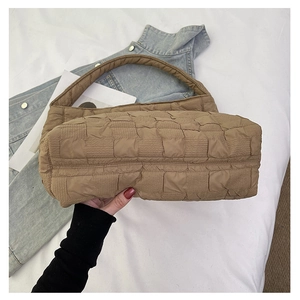 Detail of khaki quilted tote bag showing high-quality pleated texture and soft material