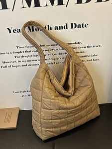 Quilted khaki tote bag for women with minimalist puffy pattern and large shoulder strap