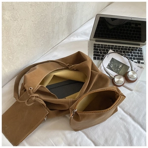 Detailed set of brown tote bag with inner pouch and laptop for office commute scenes