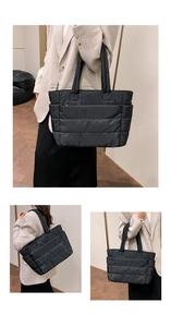 Detail view of the black quilted nylon tote bag featuring a spacious side pocket design