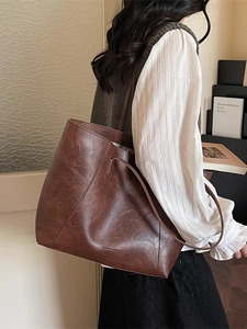 Minimalist large dark brown tote bag in faux leather for women's daily commute fashion