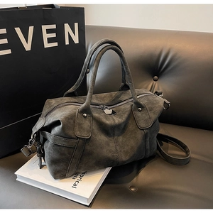 Close-up of charcoal grey retro tote bag showing frosted leather texture and hardware details