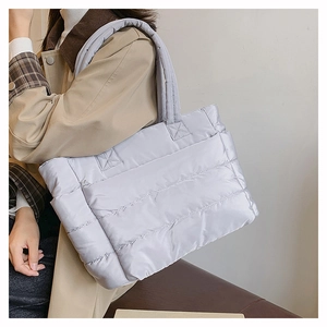 Quilted down tote bag in silver grey showing soft texture and large capacity