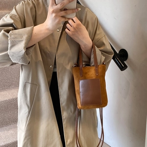 Vintage caramel faux suede crossbody bag with leather pocket and shoulder strap