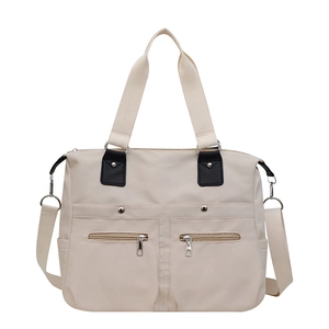 Grote beige waterdichte nylon handtas met verstelbare riem en dubbele ritsvakken op voorzijde