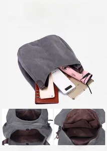 Detailed view of grey canvas tote bag interior showing large storage capacity and pockets