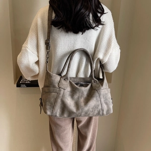 Retro brown frosted leather tote bag with dual handles and adjustable shoulder strap for women
