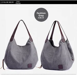 Detailed views of the gray canvas hobo bag with deep brown leather straps and square logo