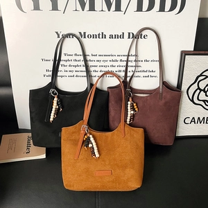 Retro suede tote bags in black, brown, and ginger yellow with wooden bead charms