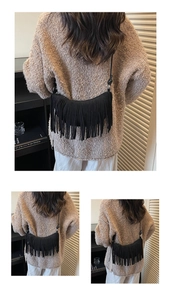 Detailed close-up showing black fringe tassel crescent bag in matte suede texture