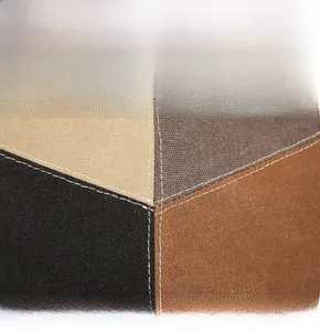Detailed view of heavy canvas tote with four-color patchwork and thick stitching