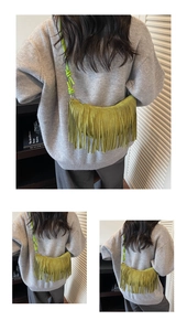 Detail view of olive green suede crescent bag with long fringe tassels and knotted strap