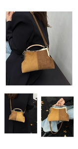 Détail du sac coquille vintage avec panneaux contrastés marron et fermoir métal rétro