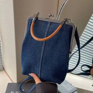 Retro denim crossbody doctor bag with brown leather handle and metal clip closure