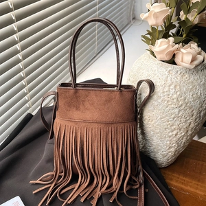 Chic brown suede fringe bucket bag with long tassels and adjustable shoulder strap