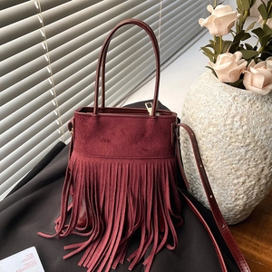 Ethnic style wine red suede bucket bag with long tassels and adjustable strap