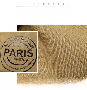 Detailed macro view of heavy-duty canvas fabric with vintage Paris airport print