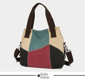 Side view of multi-color canvas tote bag showing retro patchwork and stitching details