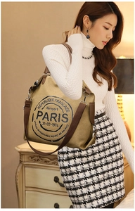 Detail of khaki canvas tote bag with vintage Paris stamp print and adjustable strap