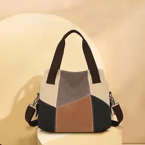 Large canvas tote bag with vintage color blocking and adjustable shoulder strap