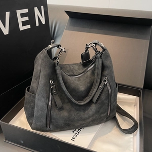 Deep grey suede shoulder bag with dual front zippers in a premium gift box presentation