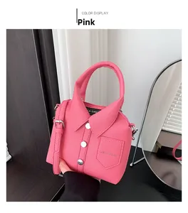 Detail of pink shirt-style handbag with lychee texture and silver button accents