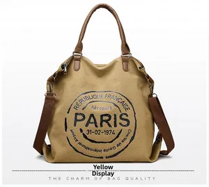 Detailed close-up of mustard yellow canvas tote bag with vintage Paris postal print