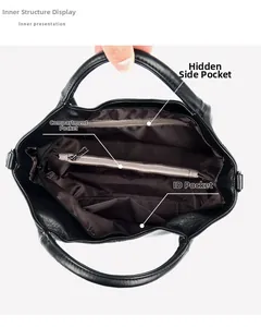 Detail view of the black tote bag interior featuring multiple zippered compartments and brown lining