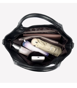 Interior view of black leather handbag showing multiple compartments and large capacity