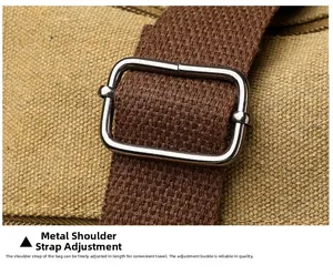 Detail of adjustable woven shoulder strap with silver metal buckle on canvas tote bag