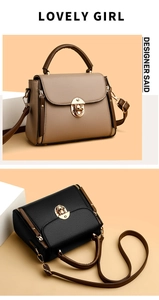 Detail of elegant two-tone khaki and black handbags with gold metal rotating locks